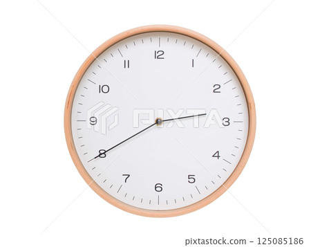 Minimal wall clock with light wood frame and white face displaying 02:40 or 14:40. Perfect for clean, modern concepts about time and scheduling. 125085186