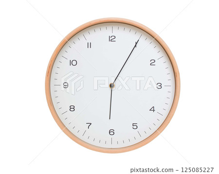 Minimal wall clock with light wood frame and white face displaying 06:05 or 18:05. Perfect for clean, modern concepts about time and scheduling. 125085227