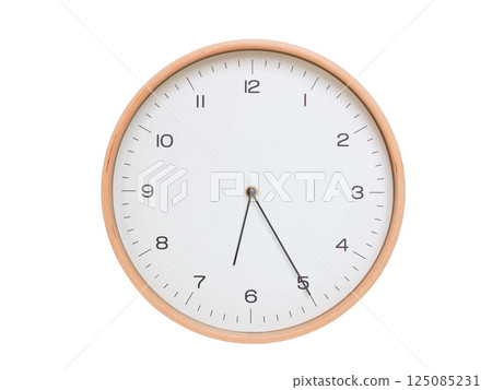 Minimal wall clock with light wood frame and white face displaying 06:25 or 18:25. Perfect for clean, modern concepts about time and scheduling. 125085231