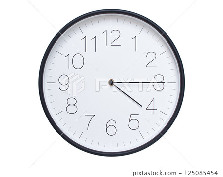 Simple wall clock with black frame and white face displaying 04:15 or 16:15. Ideal for time, schedule, and punctuality themes. 125085454