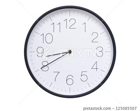 Simple wall clock with black frame and white face displaying 08:40 or 20:40. Ideal for time, schedule, and punctuality themes. 125085507