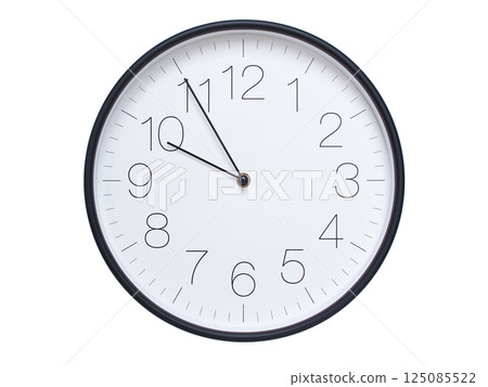 Simple wall clock with black frame and white face displaying 09:55 or 21:55. Ideal for time, schedule, and punctuality themes. 125085522