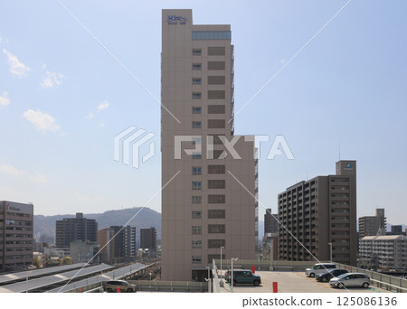 Tokushima Bunri University Takamatsu Station campus and the roof of the Takamatsu Station platform 125086136