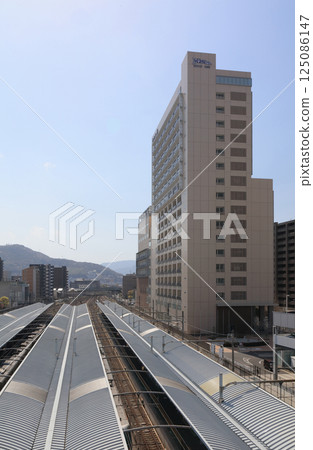 Tokushima Bunri University Takamatsu Station campus and Takamatsu Station platform 125086147