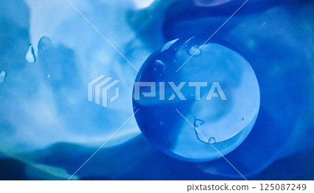 A luxurious watercolor water expression background. An abstract background of alcohol ink art with beautiful shades of blue. 125087249