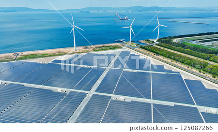 帶有風力渦輪機和太陽能電池板的混合動力發電廠的鳥瞰圖 125087266