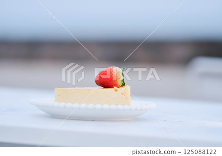 cheesecake with strawberry topping , cheese cake 125088122