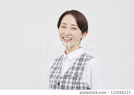 Female office worker smiling portrait white background looking at camera Female office worker smiling portrait white background looking at camera 125088215