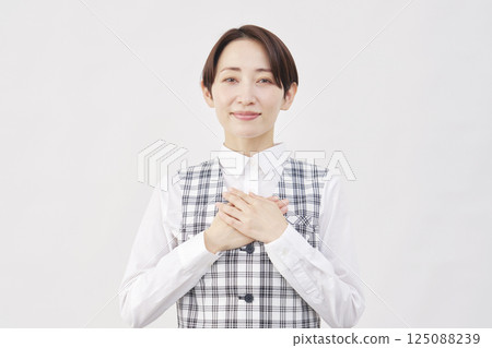 Female office worker feeling relieved on white background 125088239