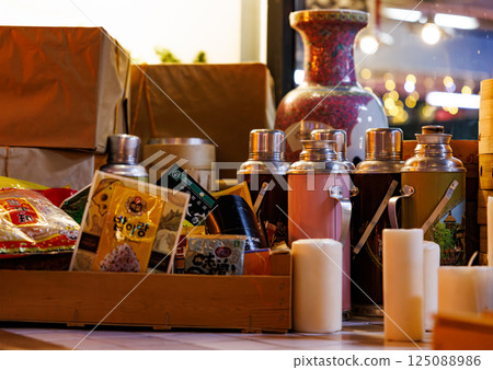 Vibrant interior filled with spices and tea sets in a bustling Chinese restaurant 125088986