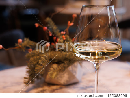 Elegant dining experience in a cozy restaurant with fine wine and tasteful decor Elegant dining experience in a cozy restaurant with fine wine and tasteful decor 125088996