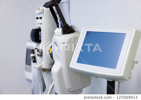 Advanced medical equipment setup in a modern healthcare facility for patient monitoring and treatment 125089013