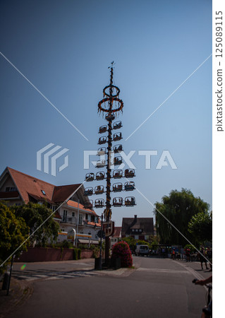 Vibrant Maypole Brings Joy to Bodensee Community During Festive Celebration Under Bright Sky 125089115