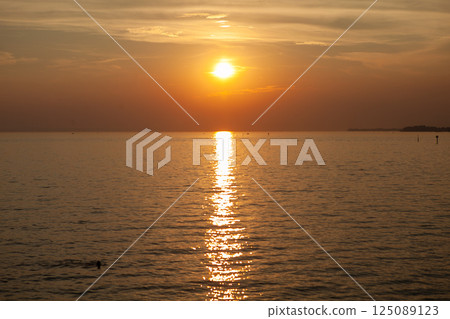 Breathtaking sunset paints the sky over Lake Constance in Germany with vibrant hues and tranquil reflections Breathtaking sunset paints the sky over Lake Constance in Germany with vibrant hues and tranquil reflections 125089123