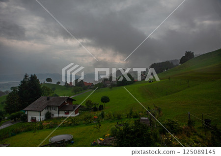 Cloudy morning over the rolling hills near Bodensee in Switzerland, creating a moody landscape Cloudy morning over the rolling hills near Bodensee in Switzerland, creating a moody landscape 125089145