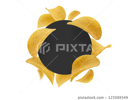 Potato chips on a white background with a black circle in the center 125089349