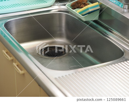 Old stainless steel kitchen sink Old stainless steel kitchen sink 125089661