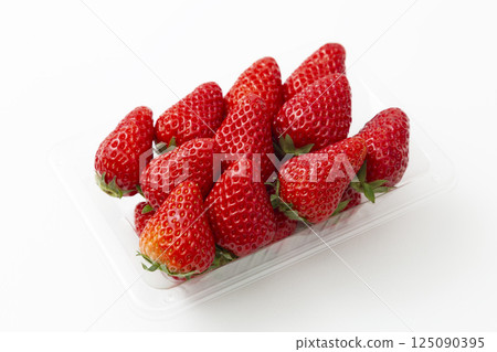 Packed strawberries on a white background Packed strawberries on a white background 125090395