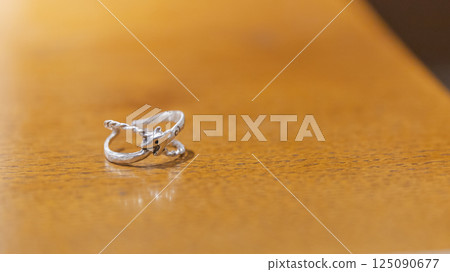 Snake design ring, product photo, wood grain Snake design ring, product photo, wood grain 125090677