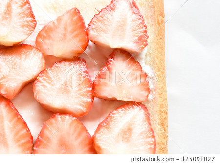 Bright red fruit sandwich topped with large strawberries and strained yogurt Bright red fruit sandwich topped with large strawberries and strained yogurt 125091027