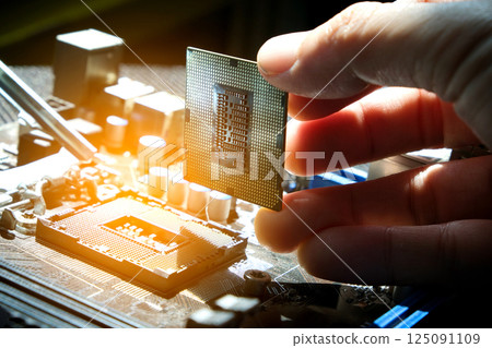 Hand of computer engineering brings computer cpu processor memory change components into socket processor for maintenance.Technology and development concept 125091109