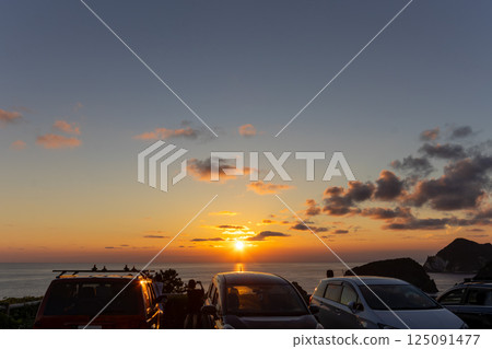 Sunset over the Pacific Ocean and silhouettes of people seen from Aiai Cape. Hirizohama Nakagi Minamiizu Town Izu Peninsula Shizuoka Prefecture 2024 Sunset over the Pacific Ocean and silhouettes of people seen from Aiai Cape. Hirizohama Nakagi Minamiizu Town Izu Peninsula Shizuoka Prefecture 2024 125091477