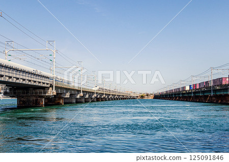 The Tokaido Shinkansen and freight trains running over Lake Hamana 125091846
