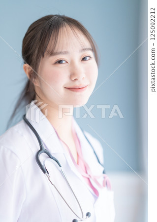 Medical workers in white coats on a white background Medical workers in white coats on a white background 125092212
