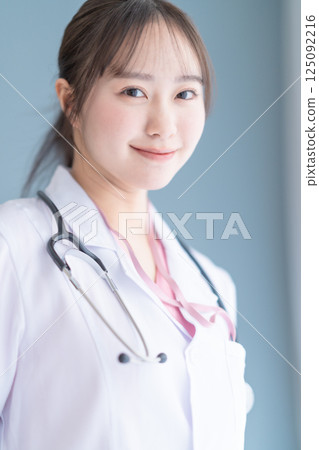 Medical workers in white coats on a white background Medical workers in white coats on a white background 125092216