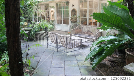 A vintage chair for decorating a backyard garden or cafe 125092281
