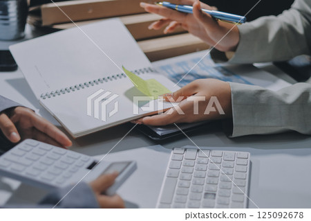Portrait of Asian young female working on laptop at office Portrait of Asian young female working on laptop at office 125092678