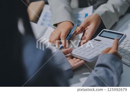 Portrait of Asian young female working on laptop at office Portrait of Asian young female working on laptop at office 125092679