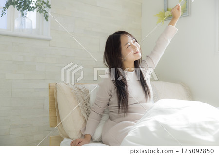 Woman getting up in bed 125092850