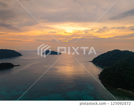 aerial view of beautiful sunset above Ko Pachumba Surin Islands aerial view of beautiful sunset above Ko Pachumba Surin Islands 125092872