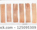 Set of watercolor brushstroke in the 2025 color of the year Mocha Mousse. Hand drawn textured template with elegant warm brown tone. Perfect for creating trendy graphic resource 125095309