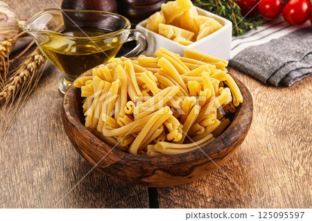 Raw dry Italian pasta - casarecce 125095597