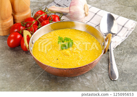 Vegetarian corn cream soup served parsley Vegetarian corn cream soup served parsley 125095653