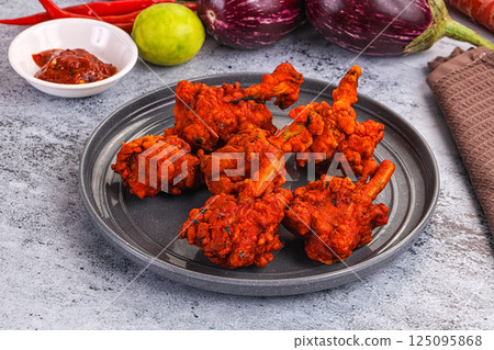 Indian cuisine - spicy Chicken lollipop Indian cuisine - spicy Chicken lollipop 125095868