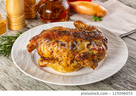 Baked in oven whole chicken with spices 125096055