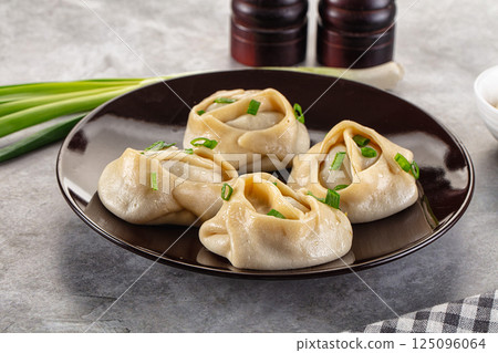 Uzbek cuisine - staffed Manti with meat 125096064