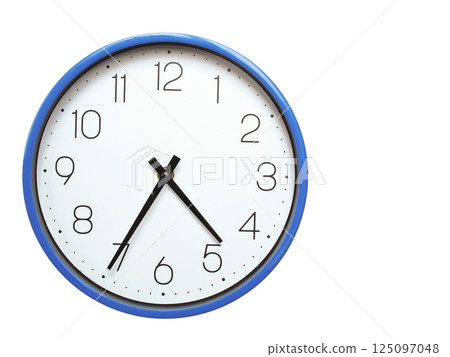 Wall clock with blue frame showing 4.35 04.35 or 16.35 O clock  on white background, suitable for time related articles, education, or punctuality concepts 125097048