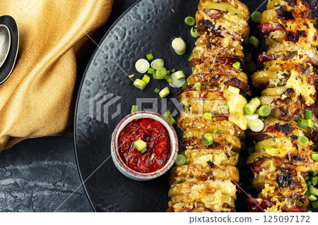 Tasty grilled meat skewers with potatoes. 125097172