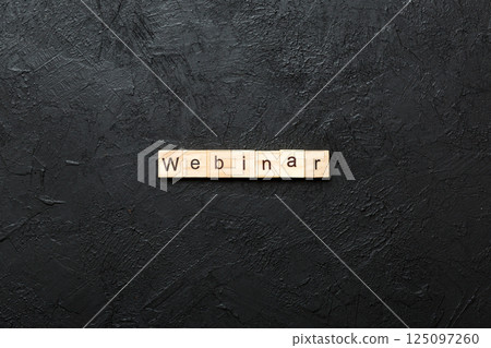 WEBINAR word written on wood block. WEBINAR text on cement table for your desing, concept WEBINAR word written on wood block. WEBINAR text on cement table for your desing, concept 125097260