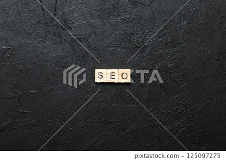 seo word written on wood block. Search Engine Optimization text on table, concept 125097275