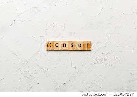 Censor word written on wood block. Censor text on cement table for your desing, concept 125097287