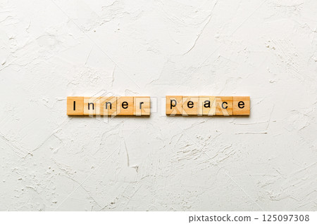 inner peace word written on wood block. inner peace text on table, concept inner peace word written on wood block. inner peace text on table, concept 125097308