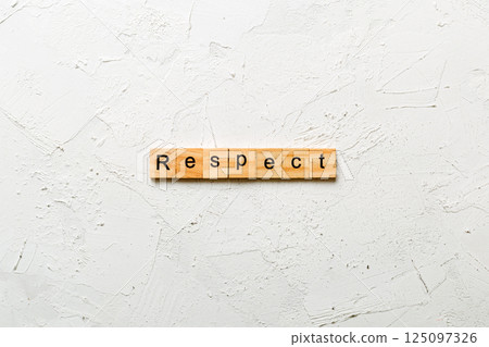 respect word written on wood block. respect text on table, concept 125097326