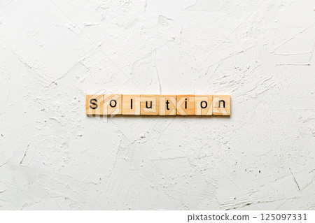 solution word written on wood block. solution text on table, concept 125097331