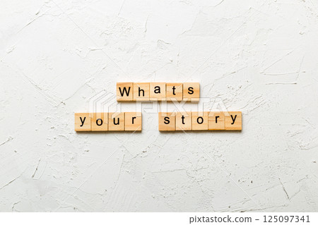 What's your story word written on wood block. What's your story text on cement table for your desing, Top view concept What's your story word written on wood block. What's your story text on cement table for your desing, Top view concept 125097341