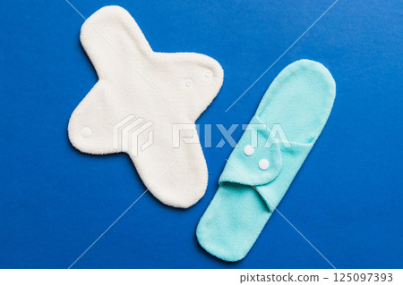 Eco-friendly reusable fabric women's pads. set of colorful bright reusable menstrual pads. zero waste woman periods concept top view with copy space 125097393